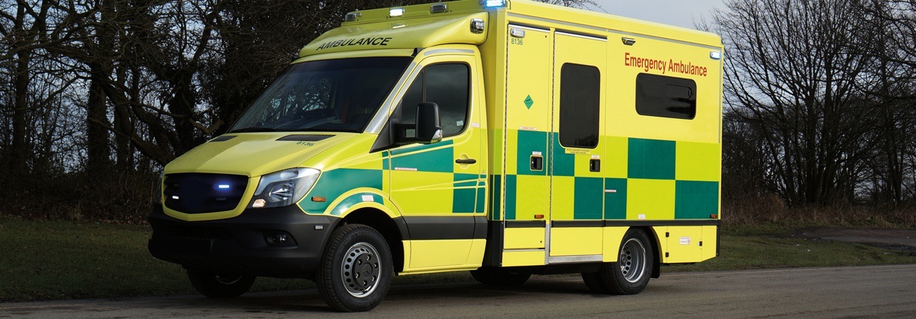 A London Ambulance Service emergency ambulance in its green and yellow battenburg livery